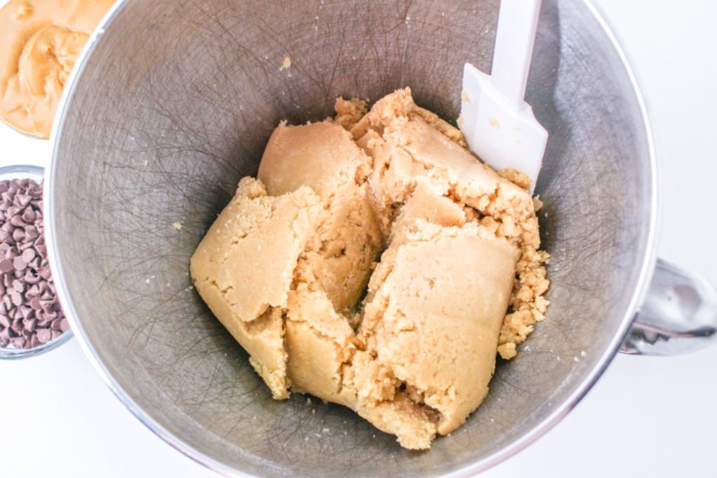 Butter mixed with flour mix forming a batter for cupcakes. 