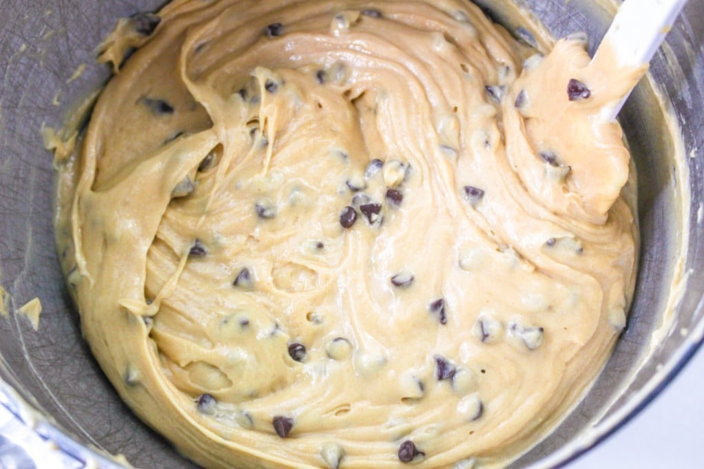 Chocolate chip cupcake batter with chocolate chips mixed in.