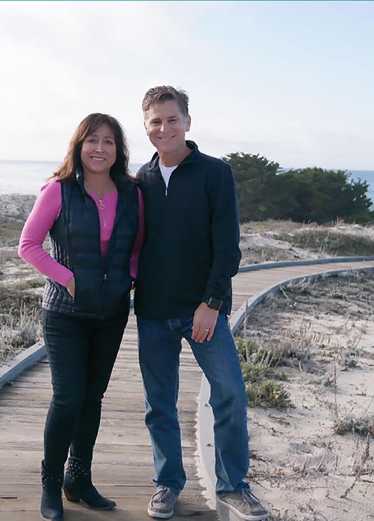 Photo of Sandra and husband at the beach