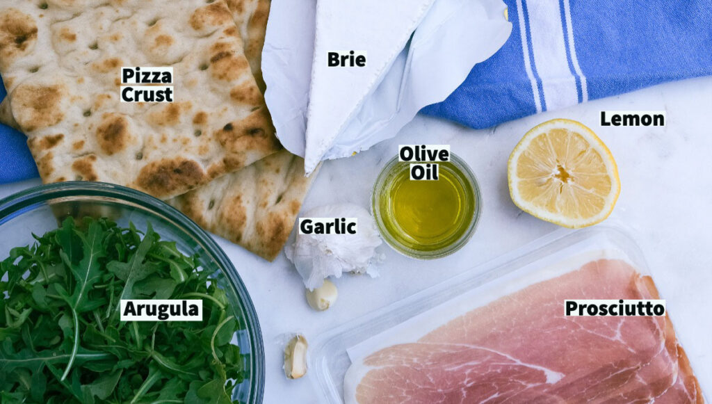 Ingredients to make arugula pizza. 