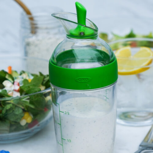 Homemade keto ranch dressing in a salad pourer jar.