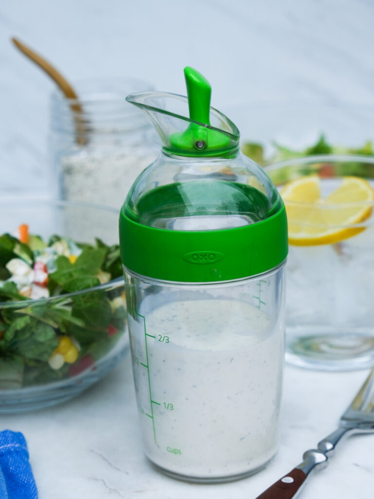 Homemade keto ranch dressing in a salad pourer jar.