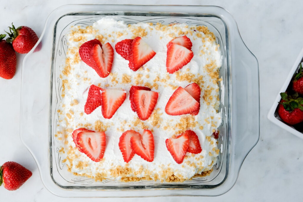 Finished strawberry cream cheese icebox cake in a clear baking dish.