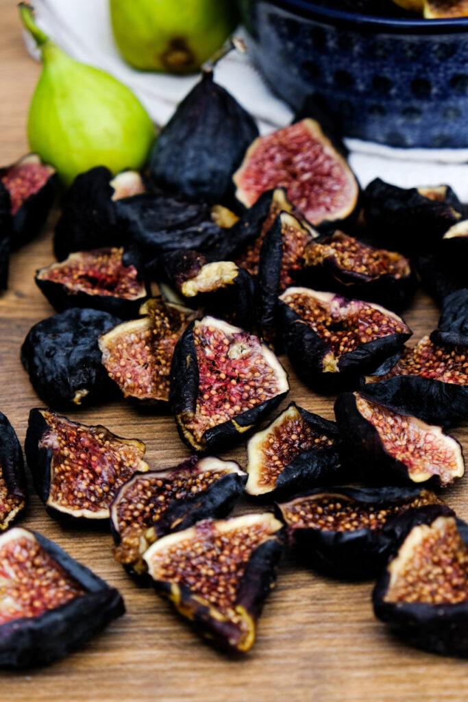 Sliced dried figs on a table ready to eat.