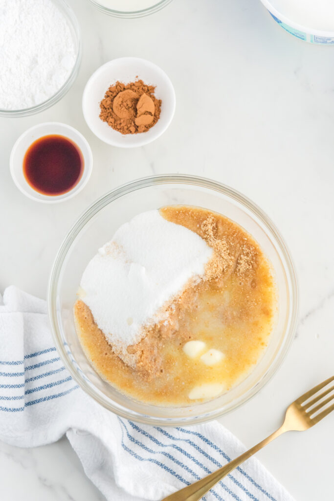 Ingredients added to a large mixing bowl for graham cracker crust.