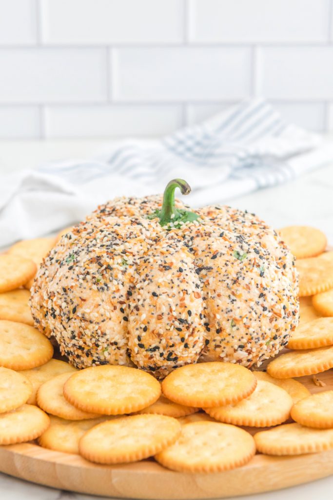 Holiday pumpkin shaped cheese ball recipe with crackers. 