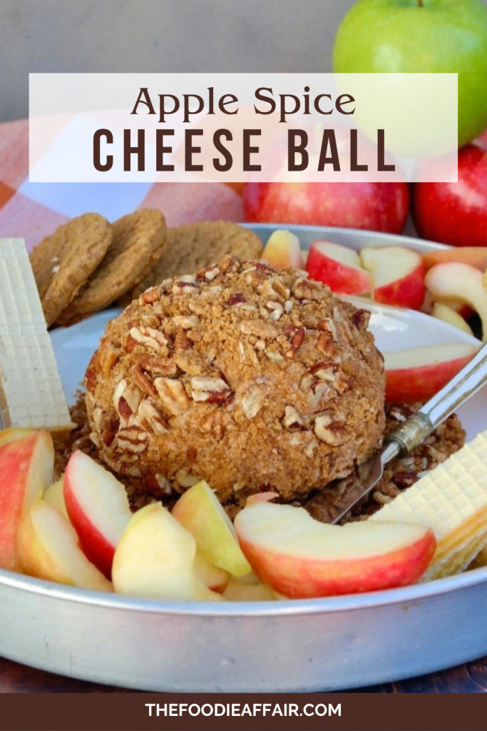 Sweet cheese ball with cookie crumbs served with apple slices. 