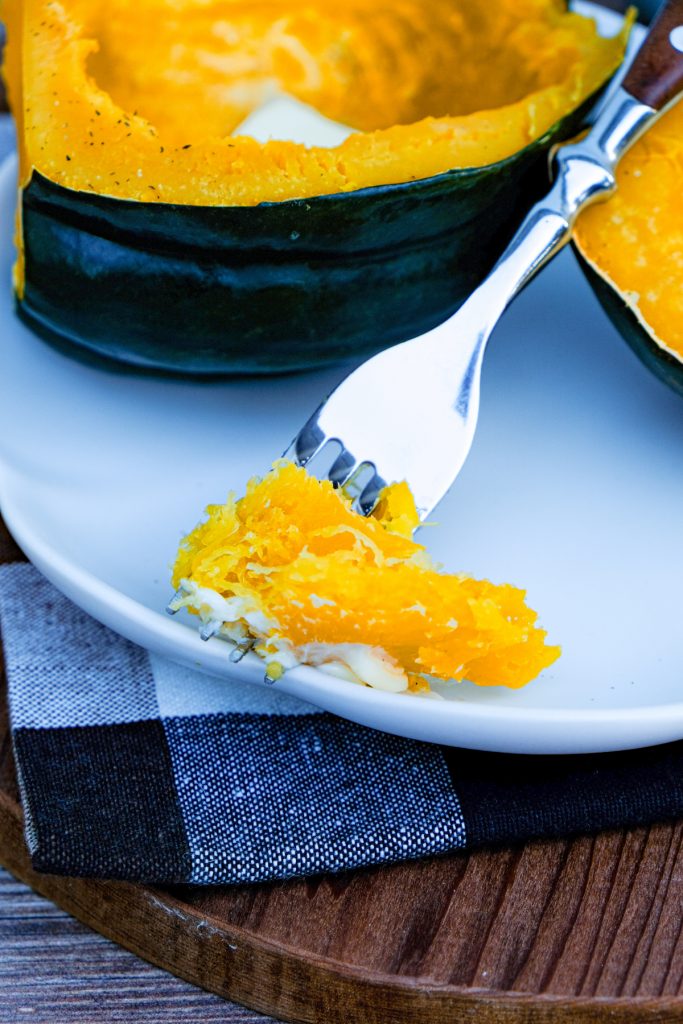 A forkful of squash with butter. 