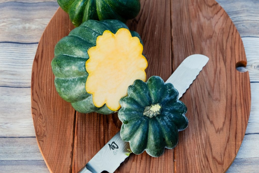 Stem sliced off of an acorn squash before cooking.