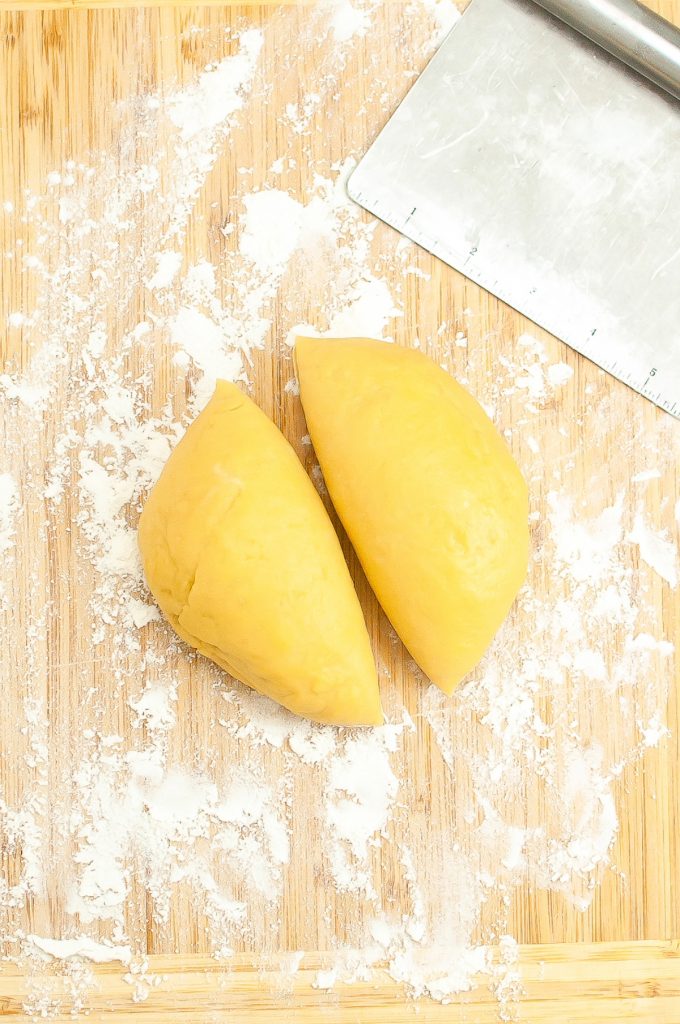 Fresh pasta dough sliced in half before rolling.