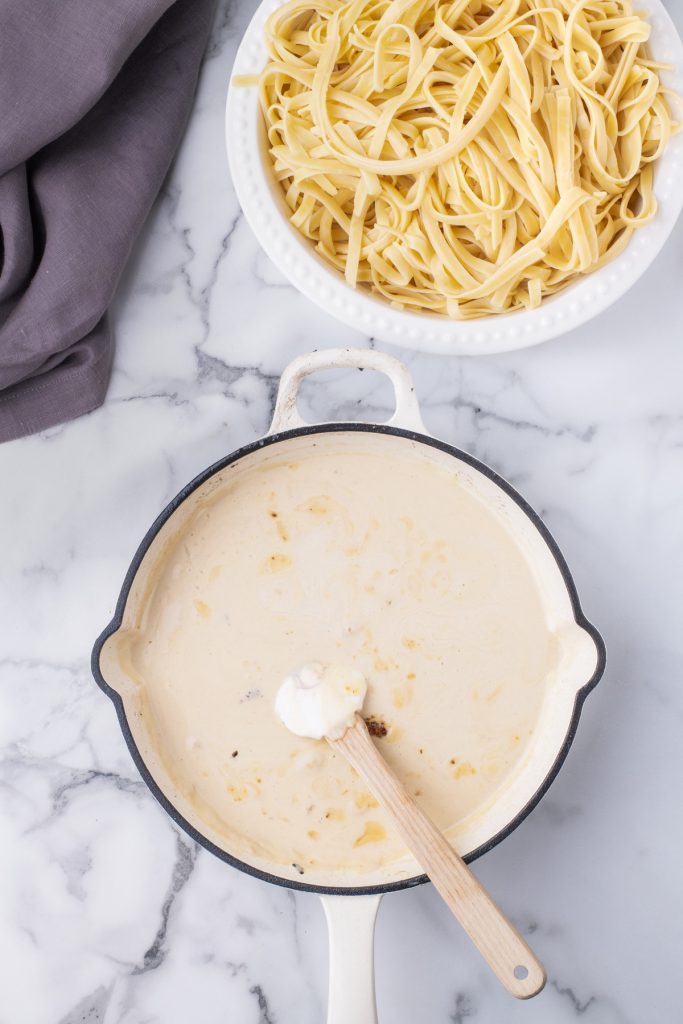 Marsala sauce in a large white skillet. 