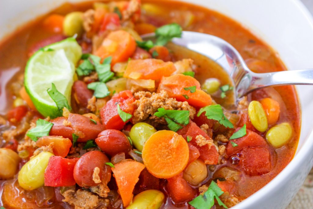 Copycat Panera turkey chili recipe in a white bowl with a slice of lime.