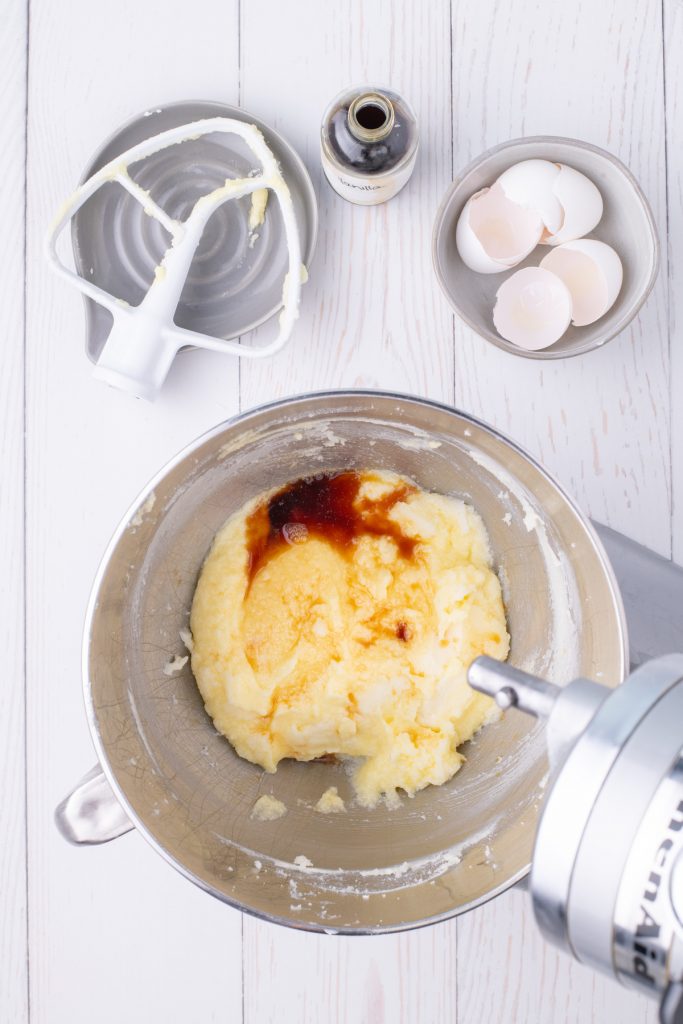 Vanilla cupcake batter in a silver mixing bowl. 