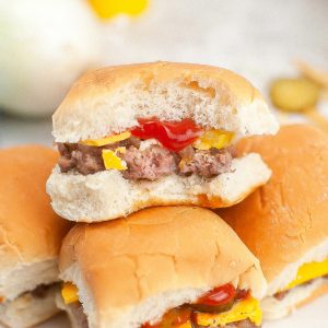 Copycat white castle hamburgers stacked on a plate.