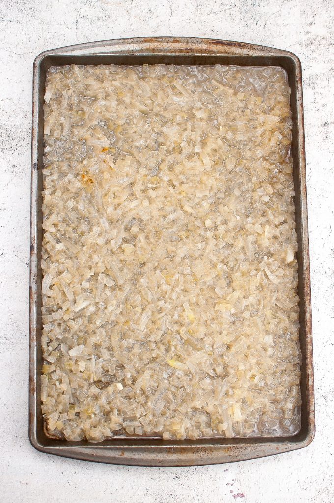 Diced onion on a baking sheet.