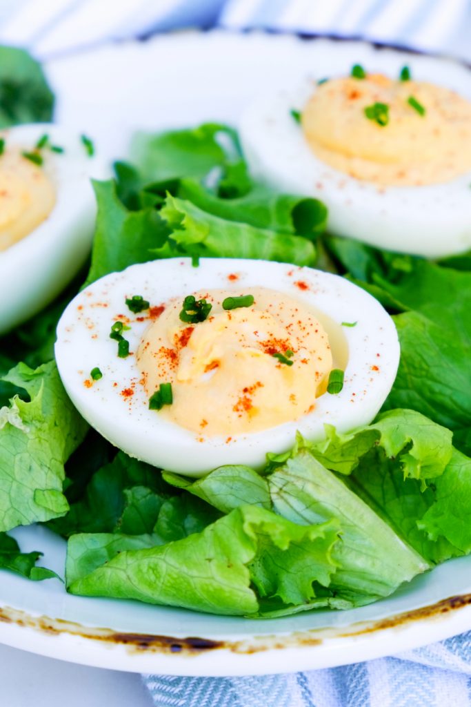 Deviled egg on a bed of lettuce.