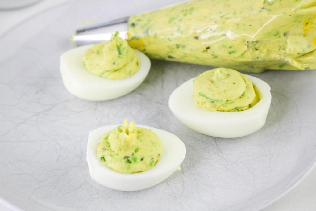 Hard boiled eggs halved and filled with the deviled egg filling.