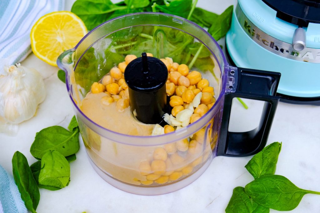 Garbanzo beans in a small food processor before blending.