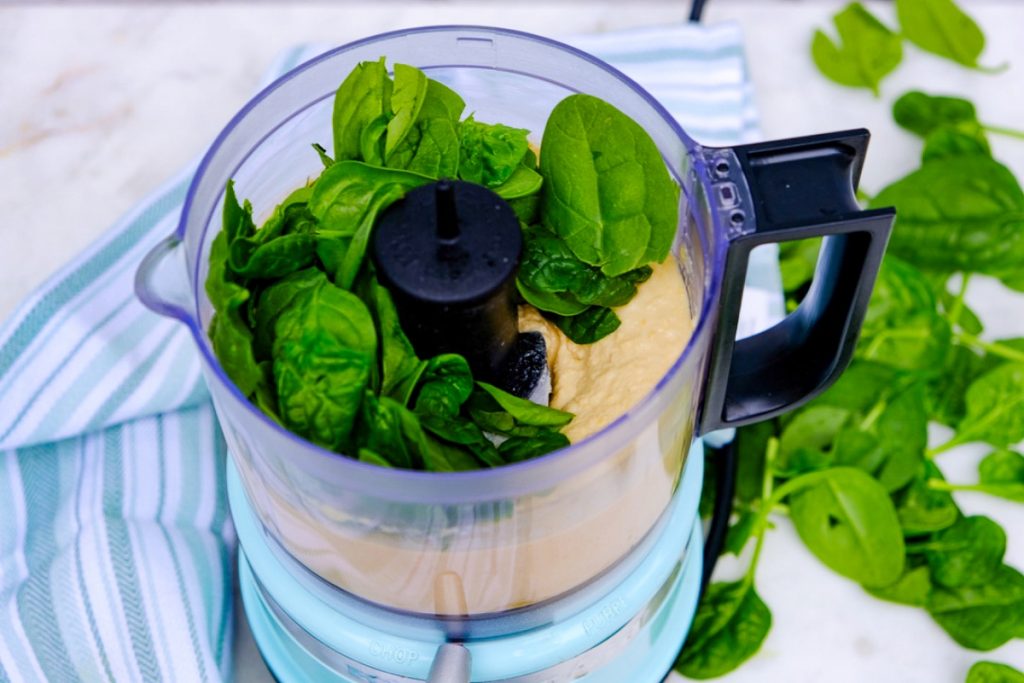 A handful of baby spinach added to mixed chickpeas. 