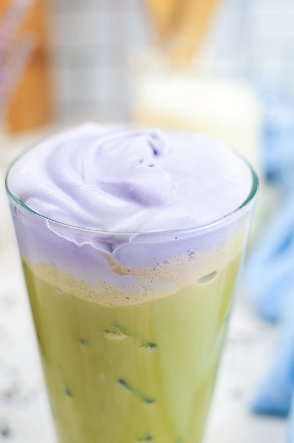 Lavender cream topped on a latte ready to drink.