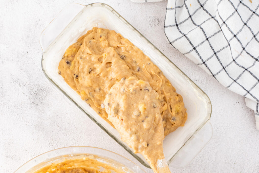 banana bread batter in a loaf pan before baking. 