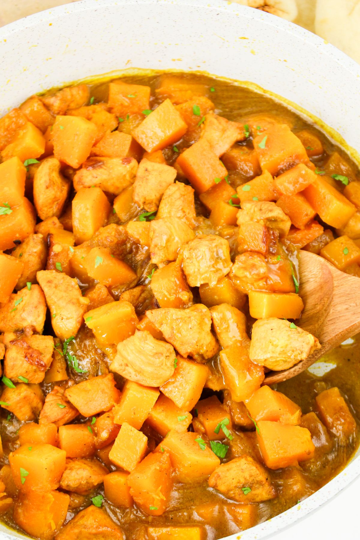 Pot full of pumpkin chicken curry ready to serve.
