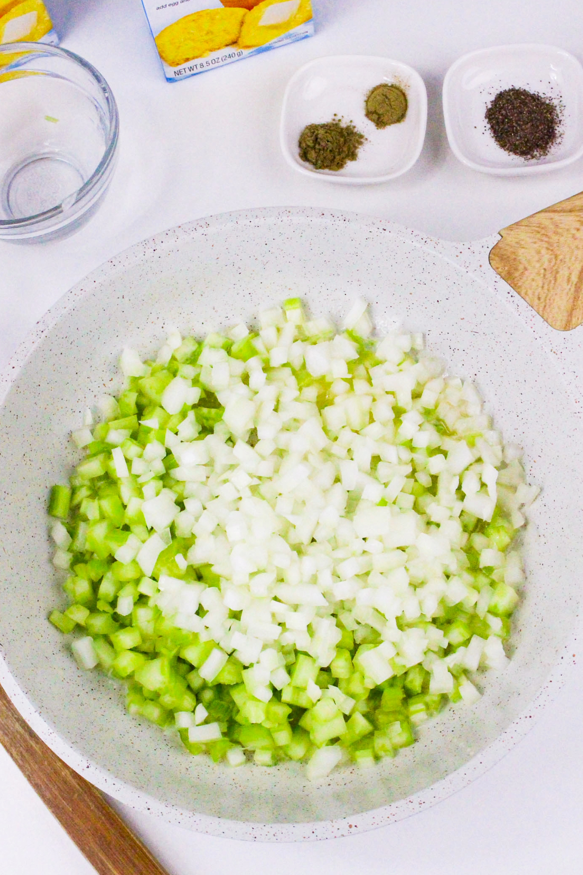 Onions and celery in a skillet.