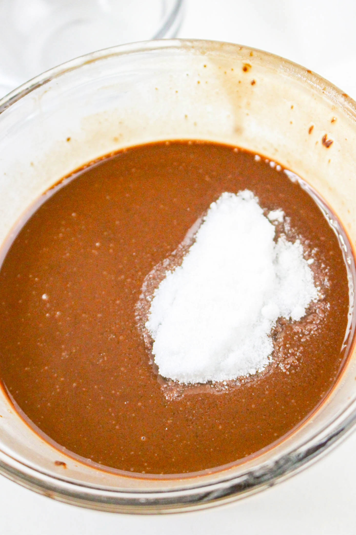 Sweetener being added to melted chocolate in a blow.
