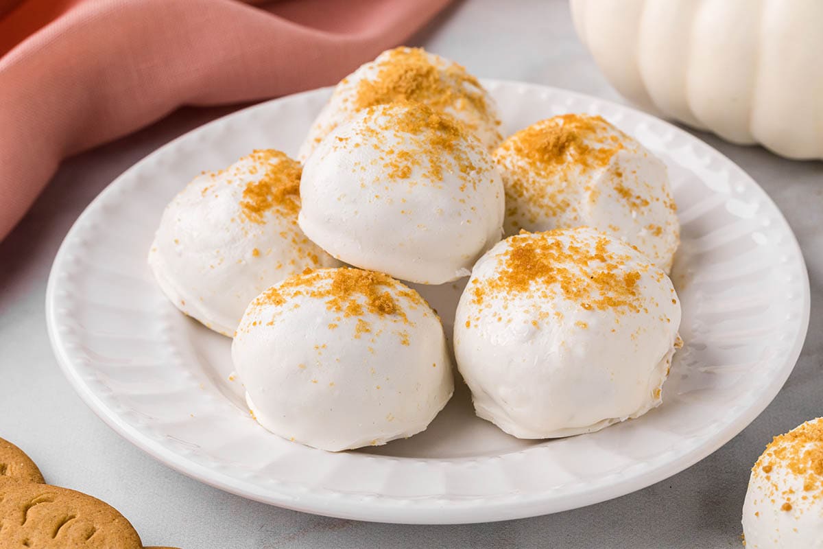 Pumpkin truffles on a plate.