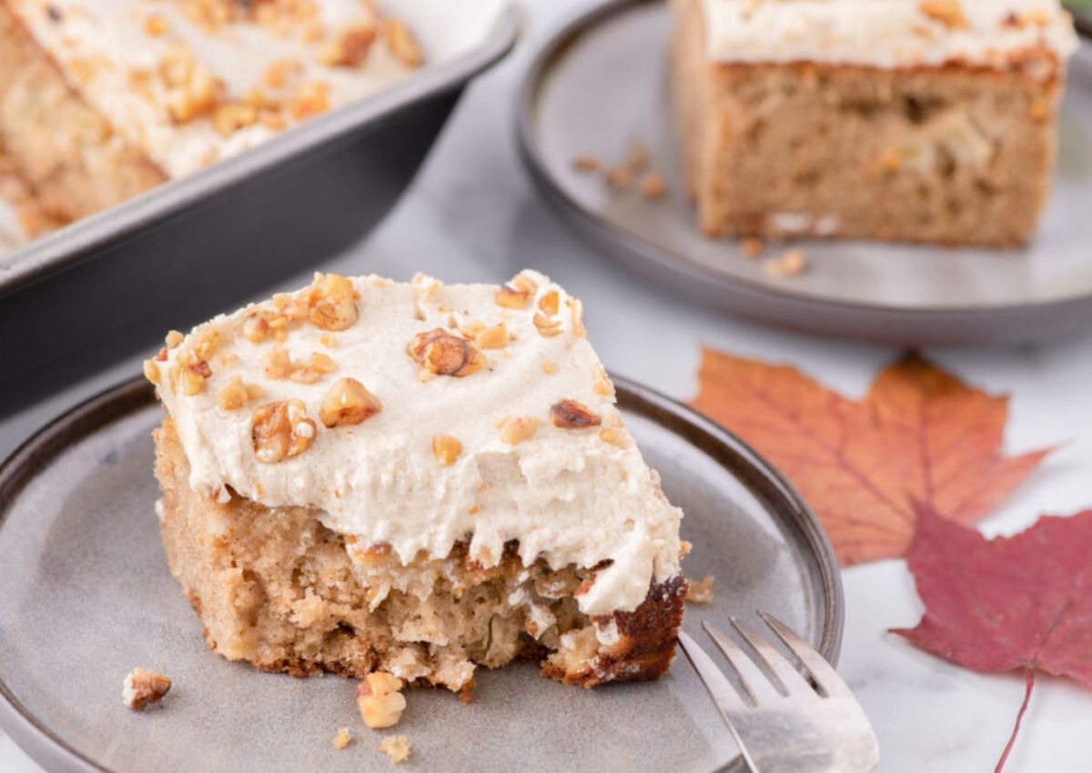 Slice of apple spice cake on a plate.