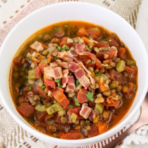 Bowl full of bacon lentil soup.