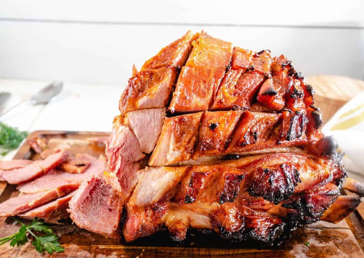 Baked ham on a cutting board..