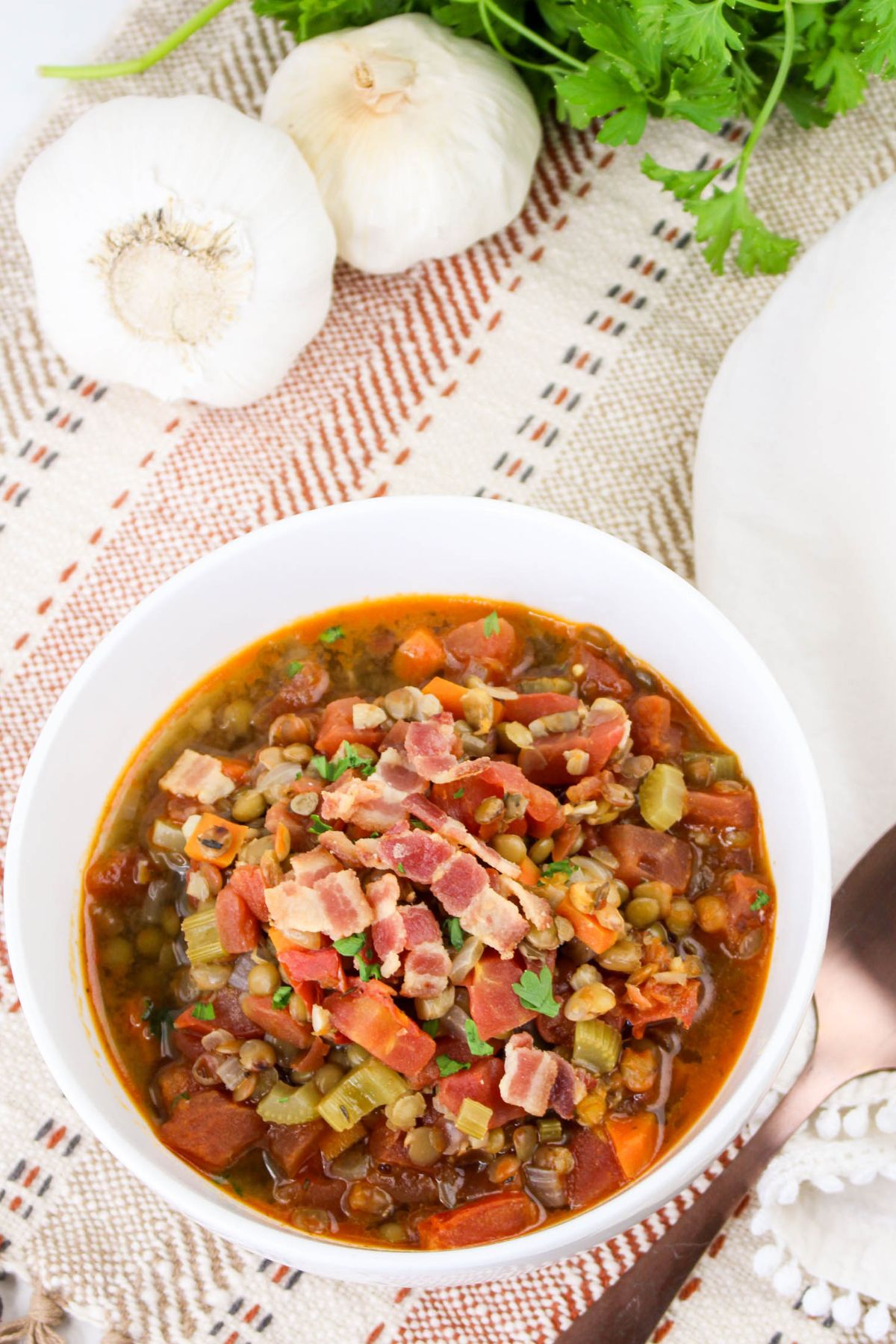 Bowl full of bacon lentil soup.