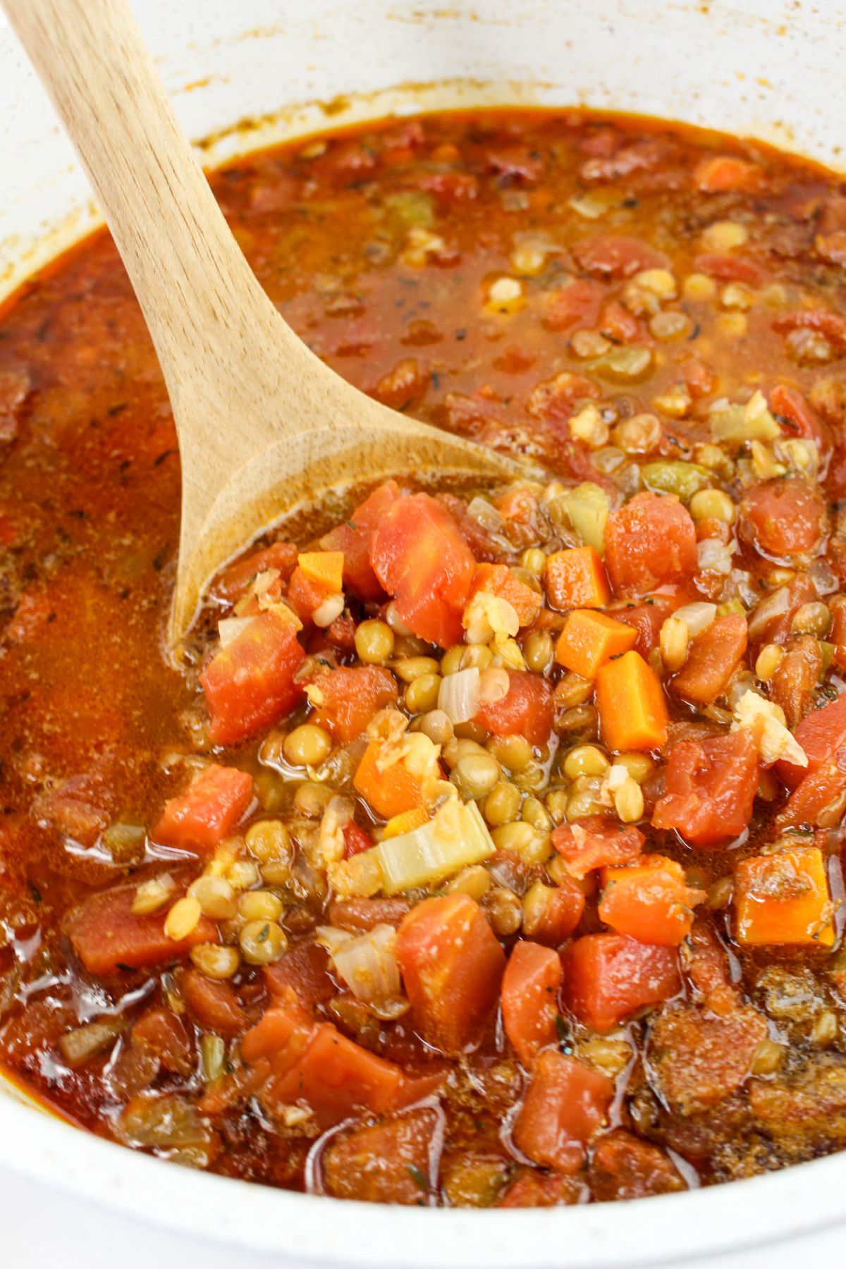 Pot full of bacon lenti soup.
