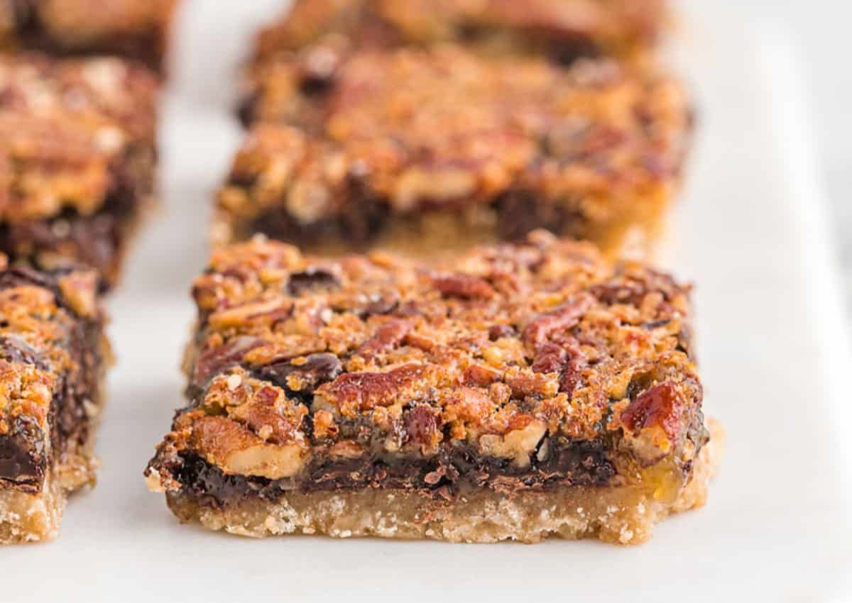 Chocolate pecan pie bar on a counter.