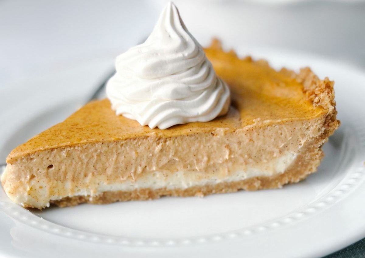 Slice of pumpkin cheesecake on a plate.
