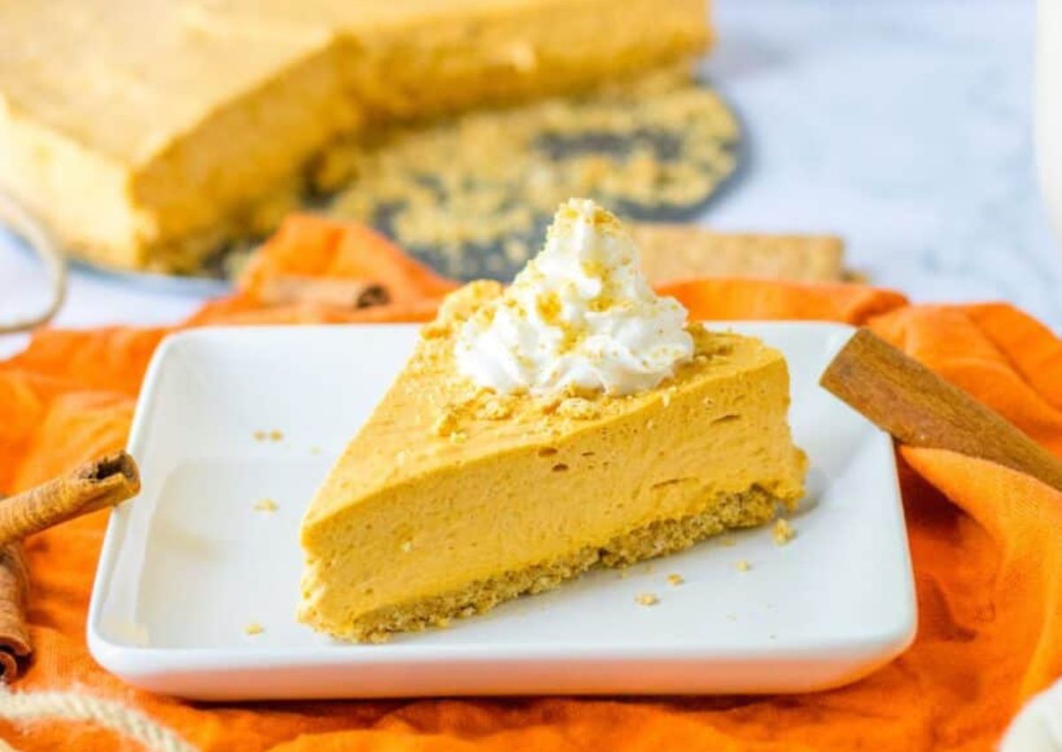Slice of pumpkin cheesecake on a plate.
