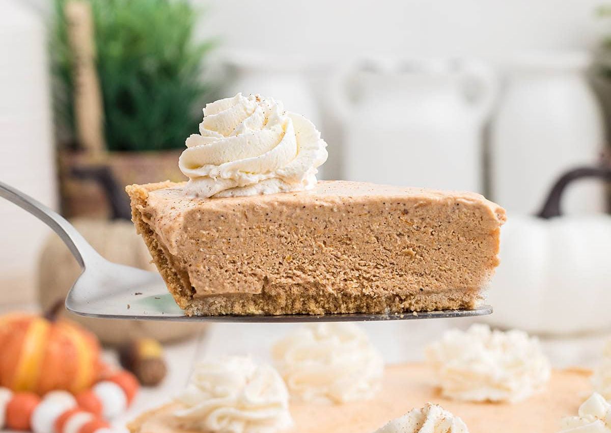 Slice of pumpkin pie on spatula.