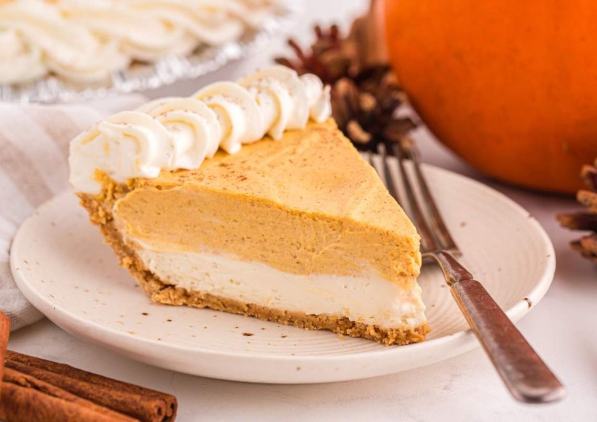 Slice of pumpkin cheesecake on plate.
