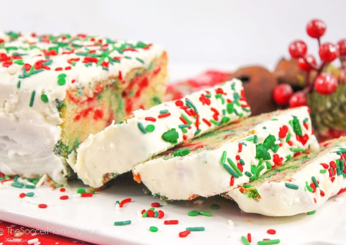 Slices of christmas bread on a cutting board.