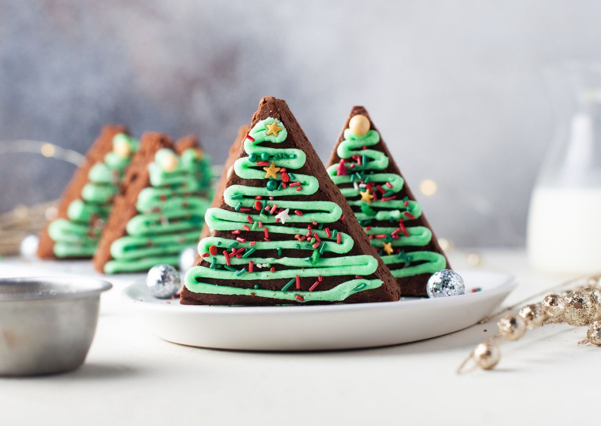 Christmas tree brownies on a small plate.