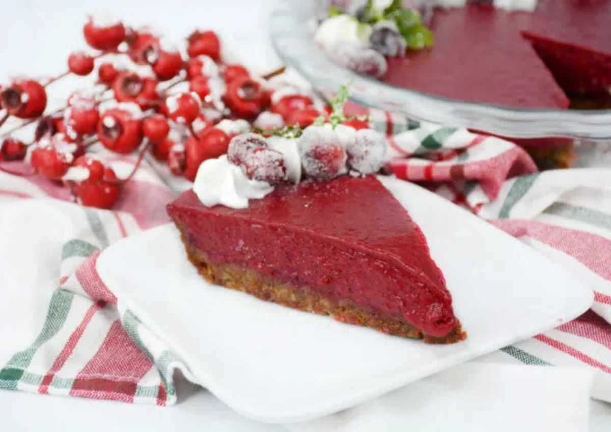 Slice of cranberry tart on a plate.