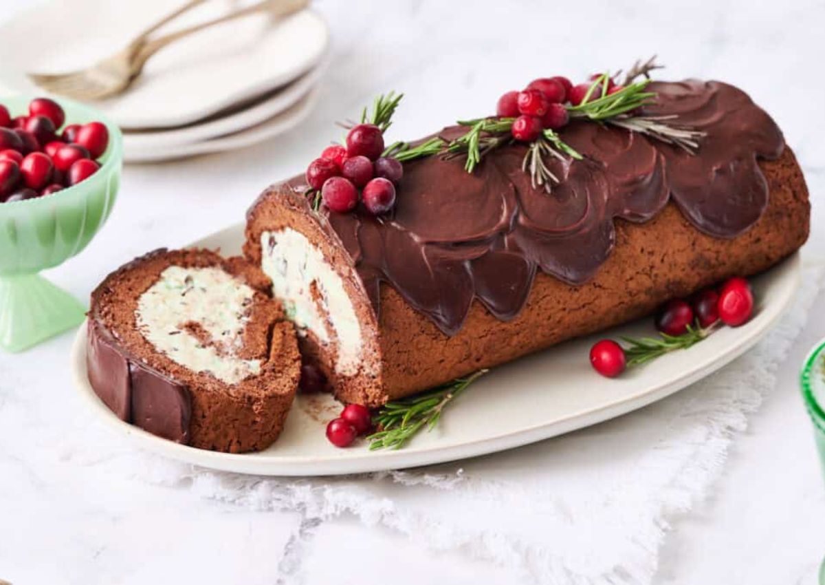 Ice cream yule log cake on a platter.