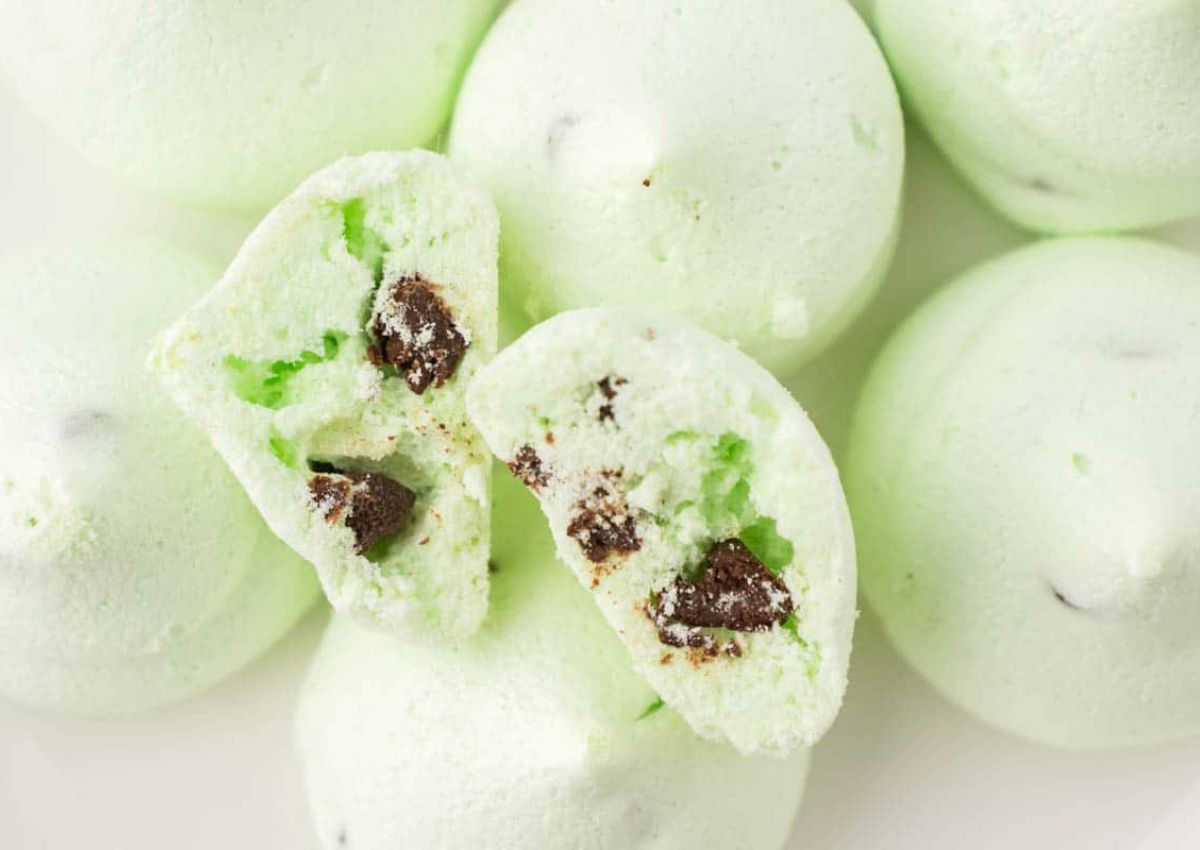 Mint meringue cookies on a counter.