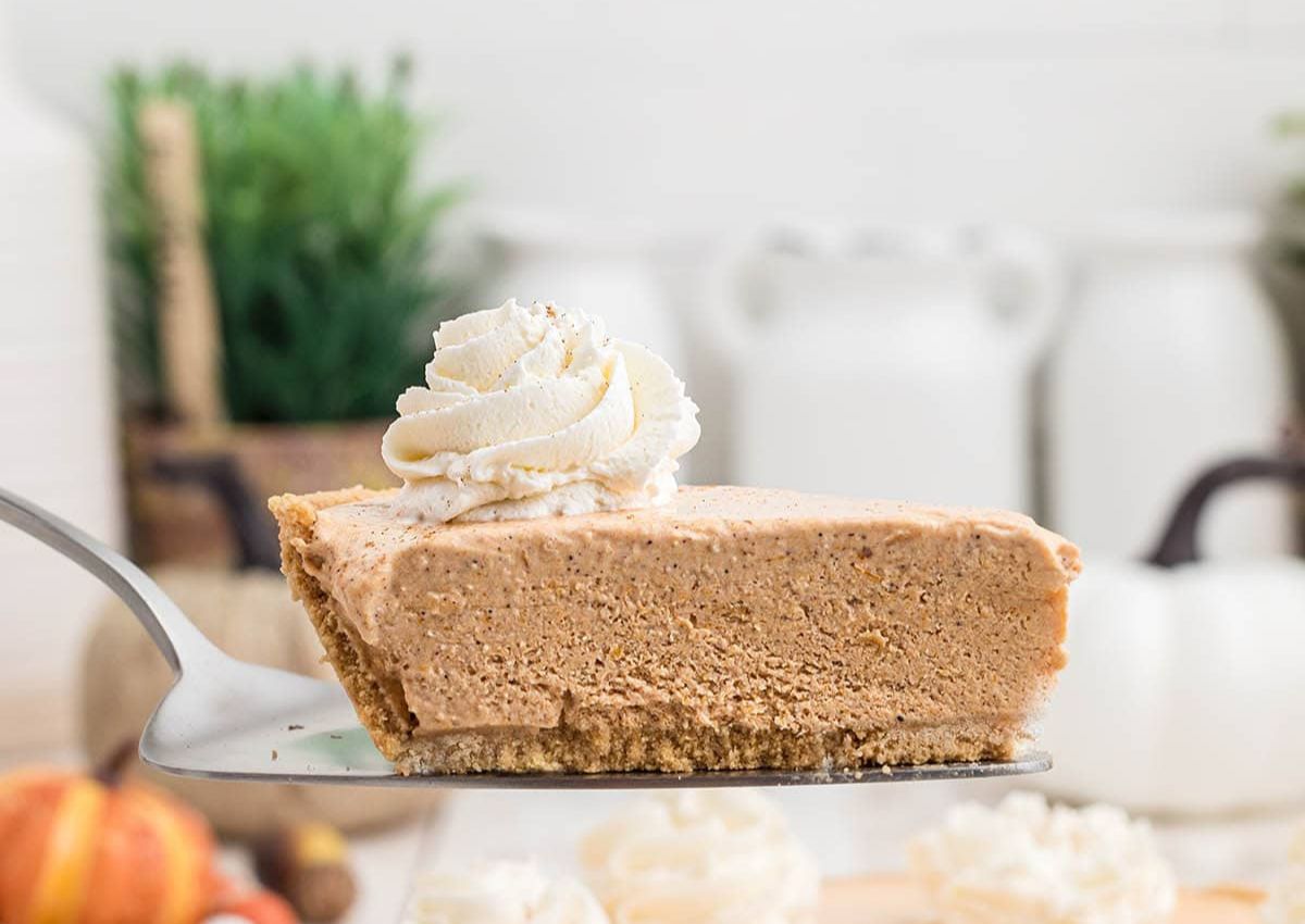 Slice of no bake pumpkin pie on a spatula.