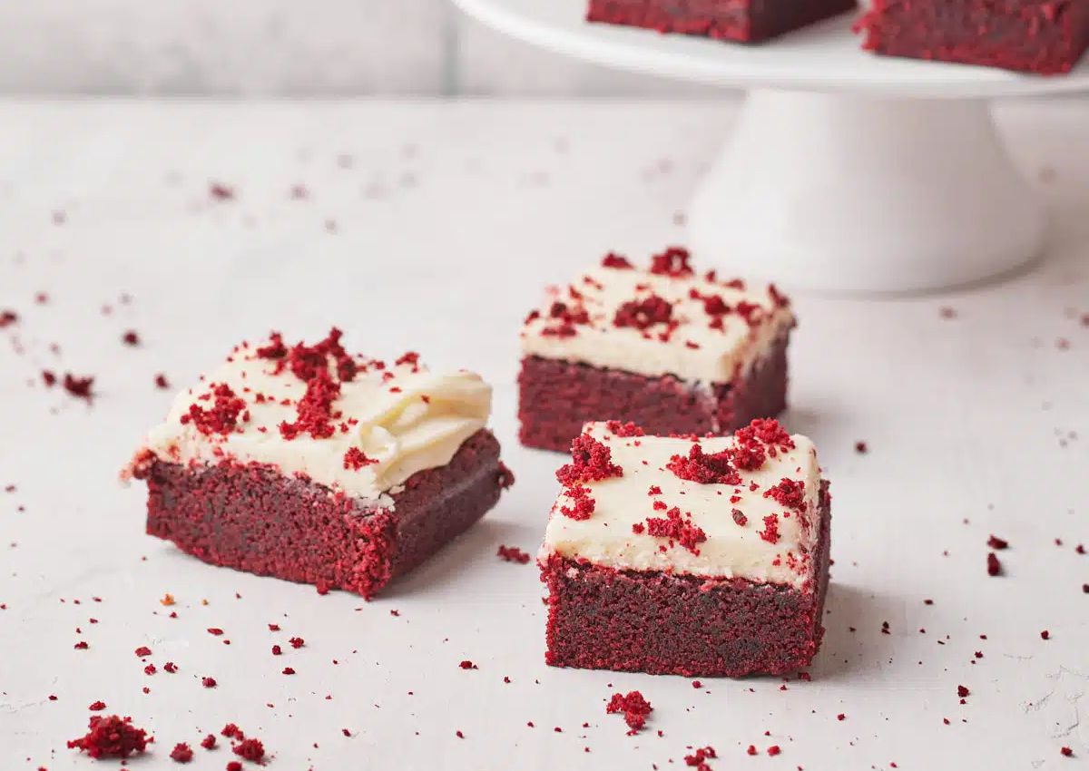 Red vevlet brownies on a counter.