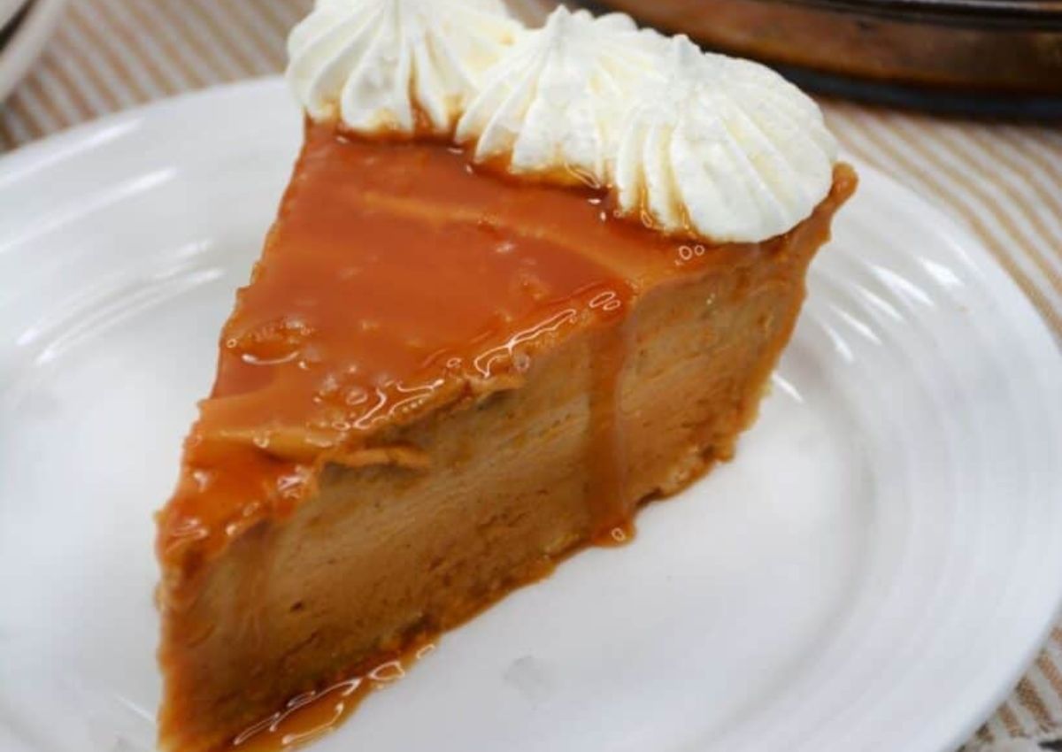 Slice of salted caramel pie on a plate.