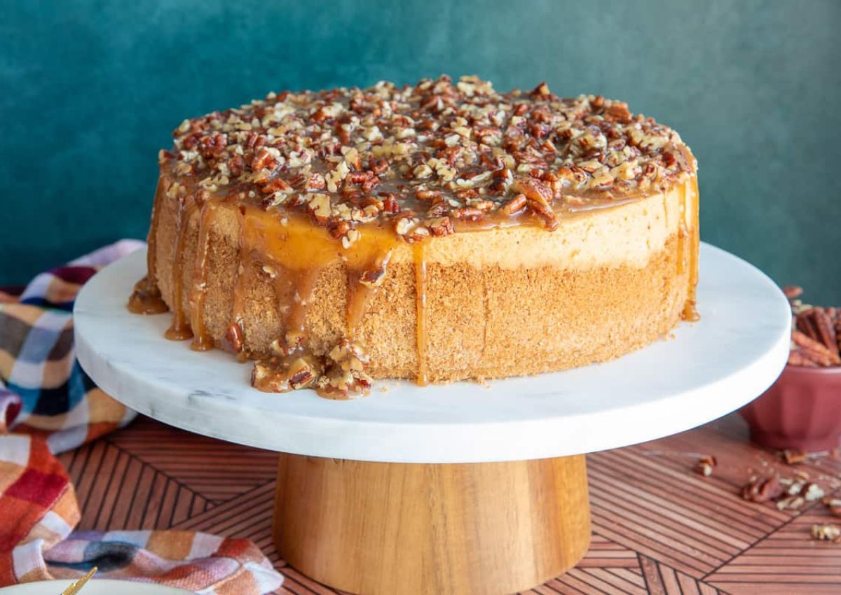 Sweet potato cheesecake on a cake stand.