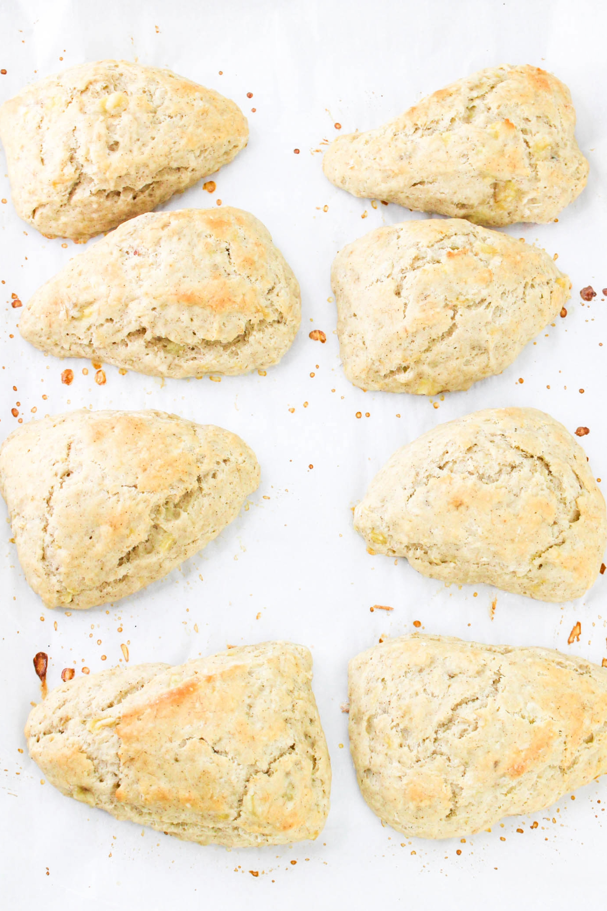 Baked scones on a baking sheet lined with parchment paper.