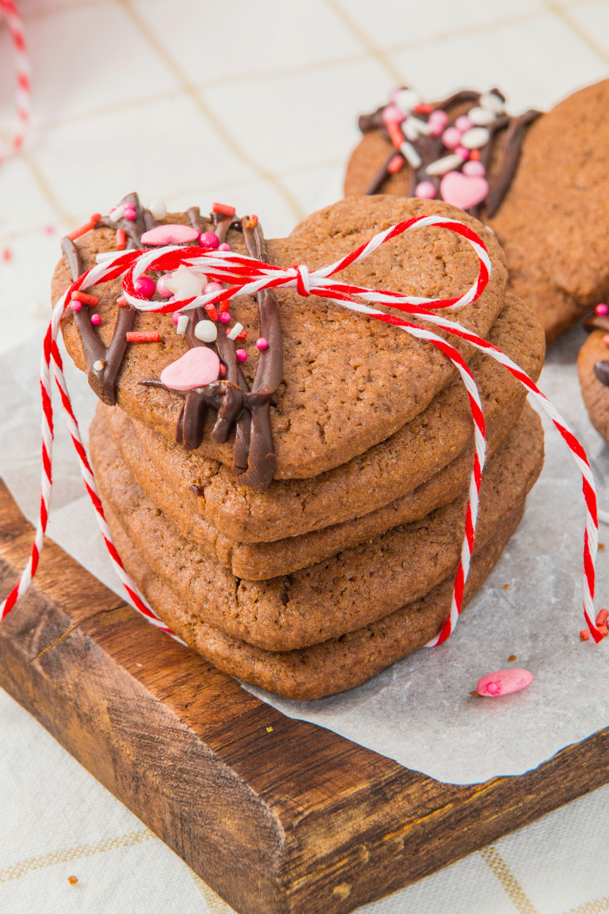Chocolate heart shaped sugar cookies with Valentine sprinkles on top.